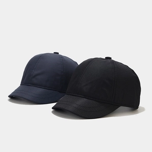 Close-up of quick-dry mesh fabric and parallel stitching on short brim baseball caps