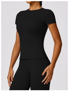Detail of high-stretch breathable fabric on black slim fit yoga and gym set for women
