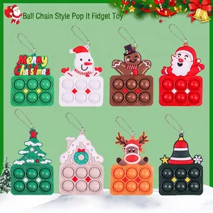 Set of eight Christmas silicone pop fidget keychains featuring Santa, reindeer and tree