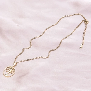 Detail of 18k gold plated stainless steel tree of life pendant on a fine link chain