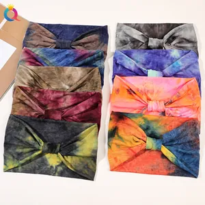 Selection of eight colorful tie-dye twist headbands made from elastic knitted fabric