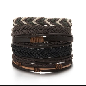 Macro shot of a 6-piece multilayer set featuring braided rope and dark leather bracelets