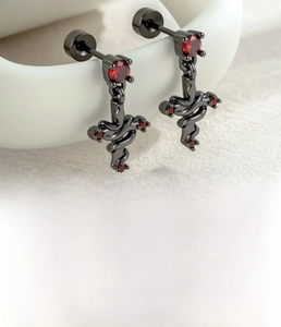 Detail of black cross earrings with red zircon and 0.8x6mm steel screw flat back post