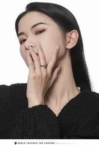 Detailed view of S925 silver ring with wrinkled texture on model finger, BREAK THROUGH THE CURRENT