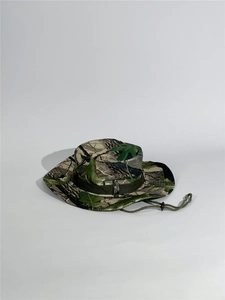 Detail of leaf camouflage boonie hat with side vents and adjustable chin strap