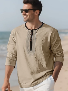 Detail of khaki cotton linen henley shirt featuring a button placket and minimalist print