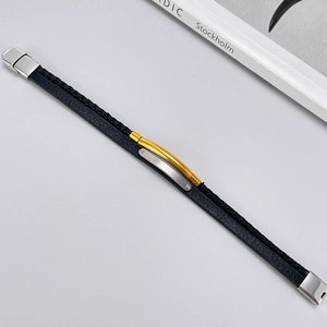 Double-layered black leather bracelet for men featuring gold and silver metal accents