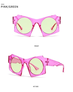 Front and side view of oversized translucent pink geometric sunglasses with green lenses