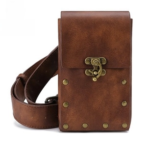 Close-up of brown vintage punk fanny pack with retro bronze metal buckle and metal rivets