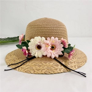 Foldable straw sun hat with flowers and black ribbon for summer beach protection