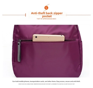 Detail of hidden anti-theft back zipper pocket on purple Oxford cloth travel tote bag