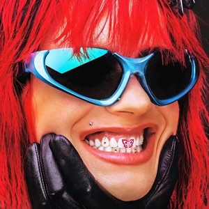 Close-up of blue mirror Y2K sunglasses with black leather gloves and red hair styling