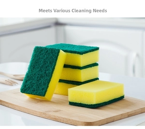 Close-up of double-sided kitchen sponges with green scouring pad and yellow sponge layer