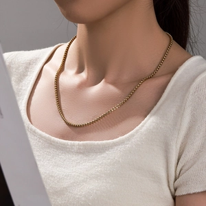 Classic 14k gold-plated box chain necklace shown on a model for a stylish look