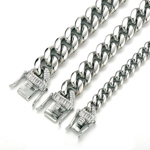 Detailed comparison of three polished silver Cuban link chains with iced-out buckles