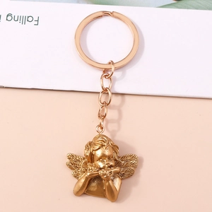 Vintage gold angel keychain with flute music motif for bags and keys accessories