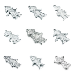 Set of 9 stainless steel boy and girl pendants in hip hop style on white background