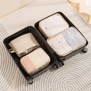 7pcs beige travel organizer bag set inside a black suitcase with breathable mesh design