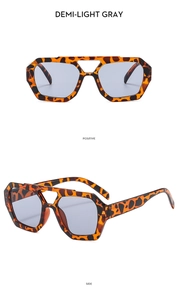 Detailed view of double bridge aviator sunglasses with tortoise frame and gray lenses
