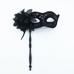 Elegant black masquerade mask with side flower and sequins on a handheld stick