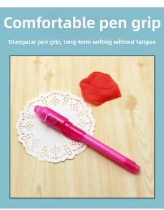 Detail of pink ergonomic triangular grip on UV light pen for comfortable long-term writing