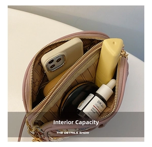 Internal view of the purple multi-layered canvas crossbody bag showing storage capacity