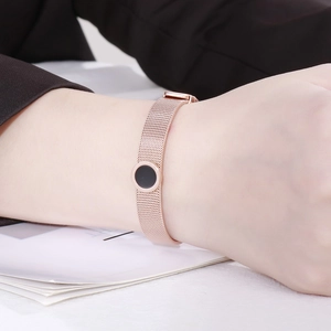 Rose gold mesh watchband bracelet with black round charm and Roman numerals for women