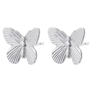 Macro view of silver butterfly stud earrings with detailed polished metallic texture