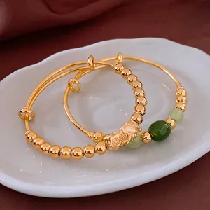 18k gold plated Pi Xiu jade bracelet set with green gemstone beads in 45-degree view