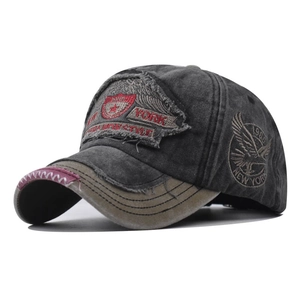 Detail of vintage washed grey baseball cap with New York embroidery and distressed brim