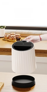 Close-up of detachable rotating knife holder with vertical texture for easy cleaning