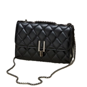 Classic black quilted crossbody bag with metal chain strap and turn-lock closure