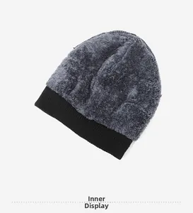 Detail showing the thick faux shearling lining of the black winter knit beanie
