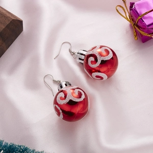 Festive red Christmas ball drop earrings with white spiral glitter on white satin