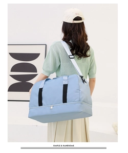 Large blue travel bag with wet-dry separation and expandable bottom compartment