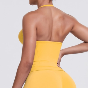 Detail view of the seamless backless design on this bright yellow yoga crop top