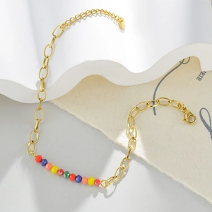 Detail of 14k gold plated chain bracelet with colorful faceted beads and lobster clasp