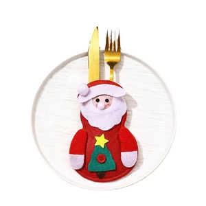 Santa Claus themed felt cutlery holder for festive Christmas dinner table settings