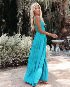 Detail of turquoise summer maxi dress with layered tiered skirt and pleated bodice