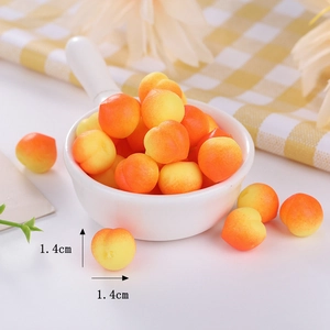 Detailed macro view of 1.4cm miniature TPR peach toys with gradient color finish