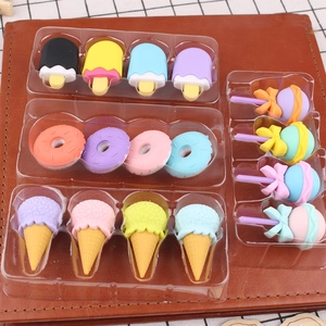 Detailed view of colorful dessert-shaped erasers including ice cream and donuts in a tray