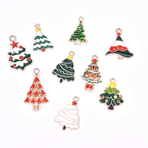 Flat lay of colorful enamel Christmas tree alloy charms in red and green for DIY jewelry