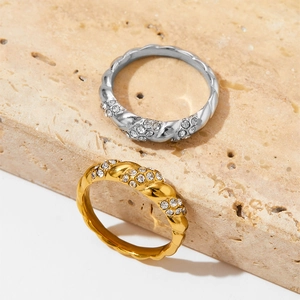 Vintage twisted rope rings in gold and silver set with sparkling zircon accents