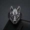 Macro shot of vintage stainless steel wolf head ring with detailed Viking texture