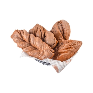 Artificial rye bread set in wire basket with newspaper liners for photography props
