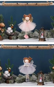 Detail of Christmas angel hanging dolls with mesh skirts and shimmering sequin stars
