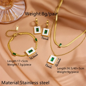Golden stainless steel jewelry set featuring green zircon and white enamel on champagne silk