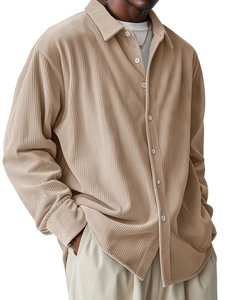 Detail of khaki corduroy shirt fabric texture and casual loose fit button-down design