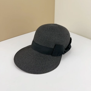 Elegant black woven straw sun hat with decorative ribbon bow for summer UV protection
