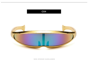 Detail of golden Y2K visor sunglasses with iridescent lenses and futuristic visor design